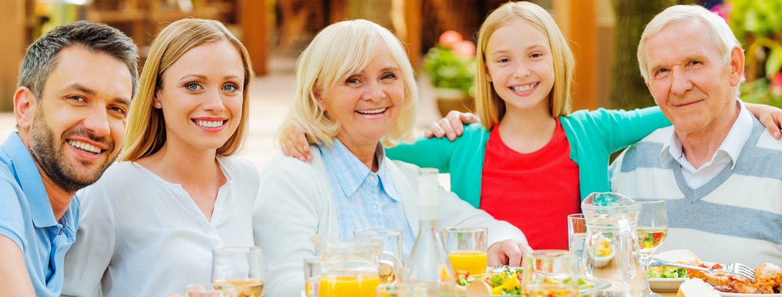 multigenerational familiy smiling at the camera