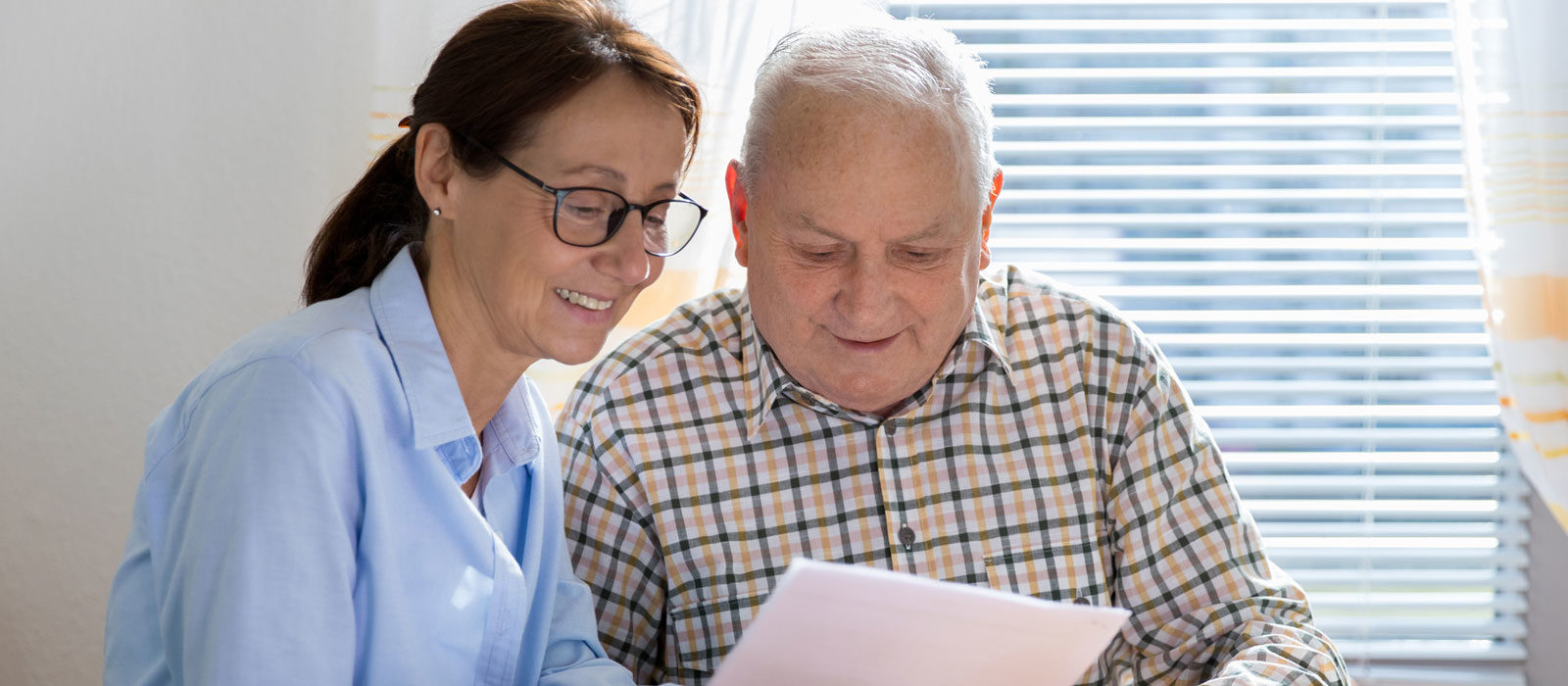 Older couple looking at paperwork.