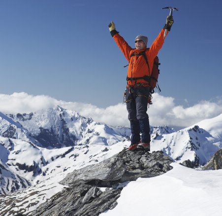 mountain climber standing on top of the summit